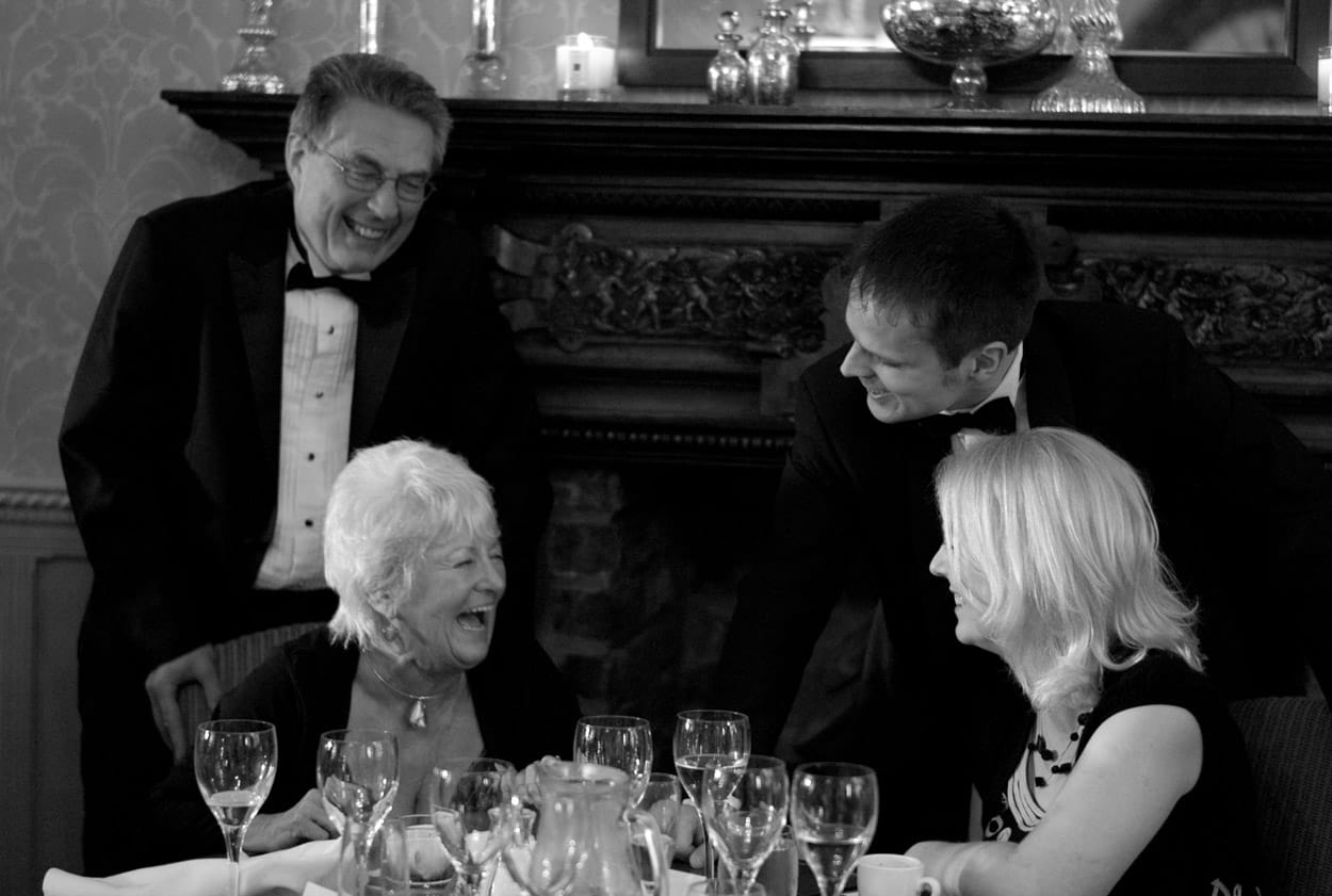 Black and white table group portrait full of smiles and personality.