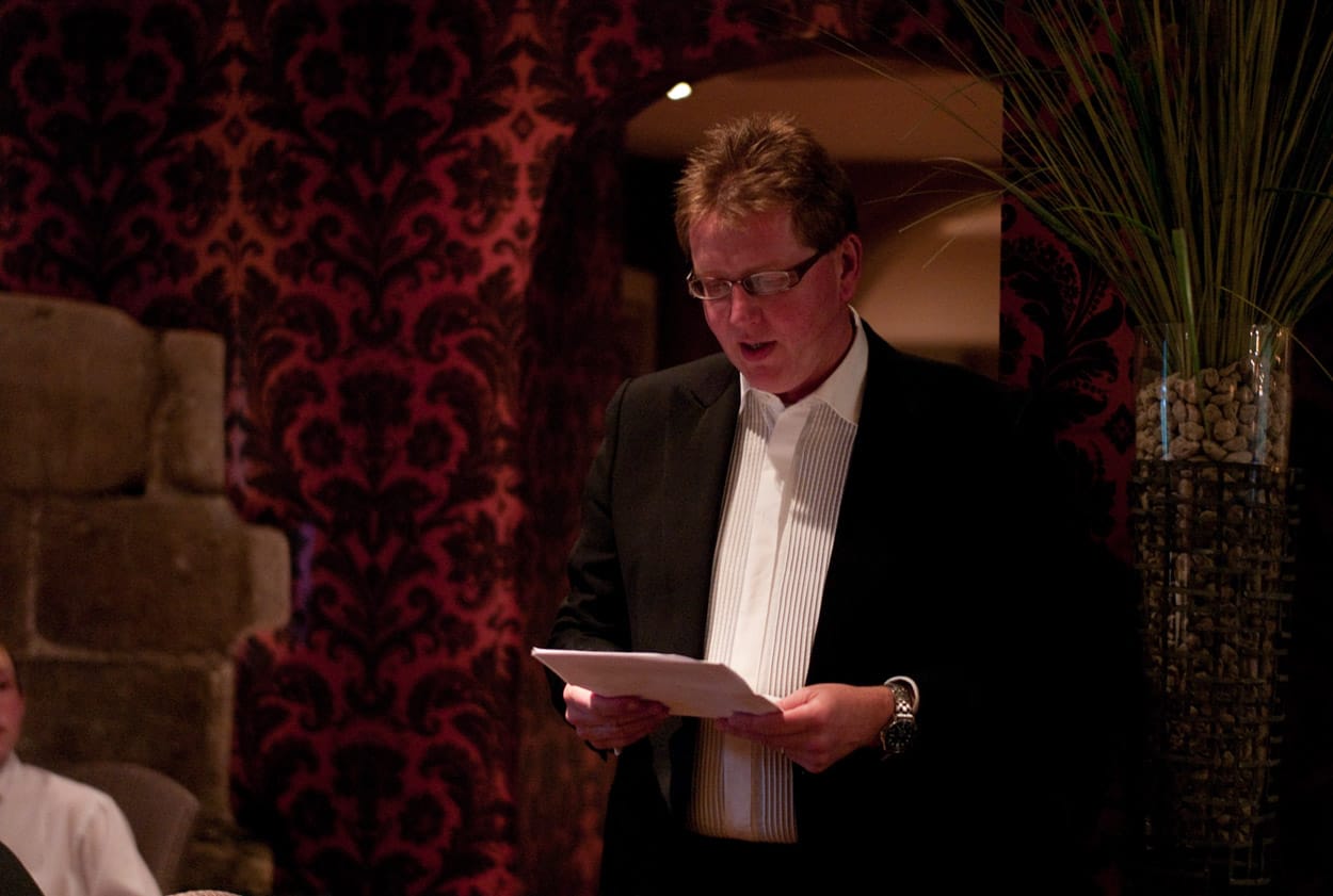 Best Man delivering his speech to the room of guests.