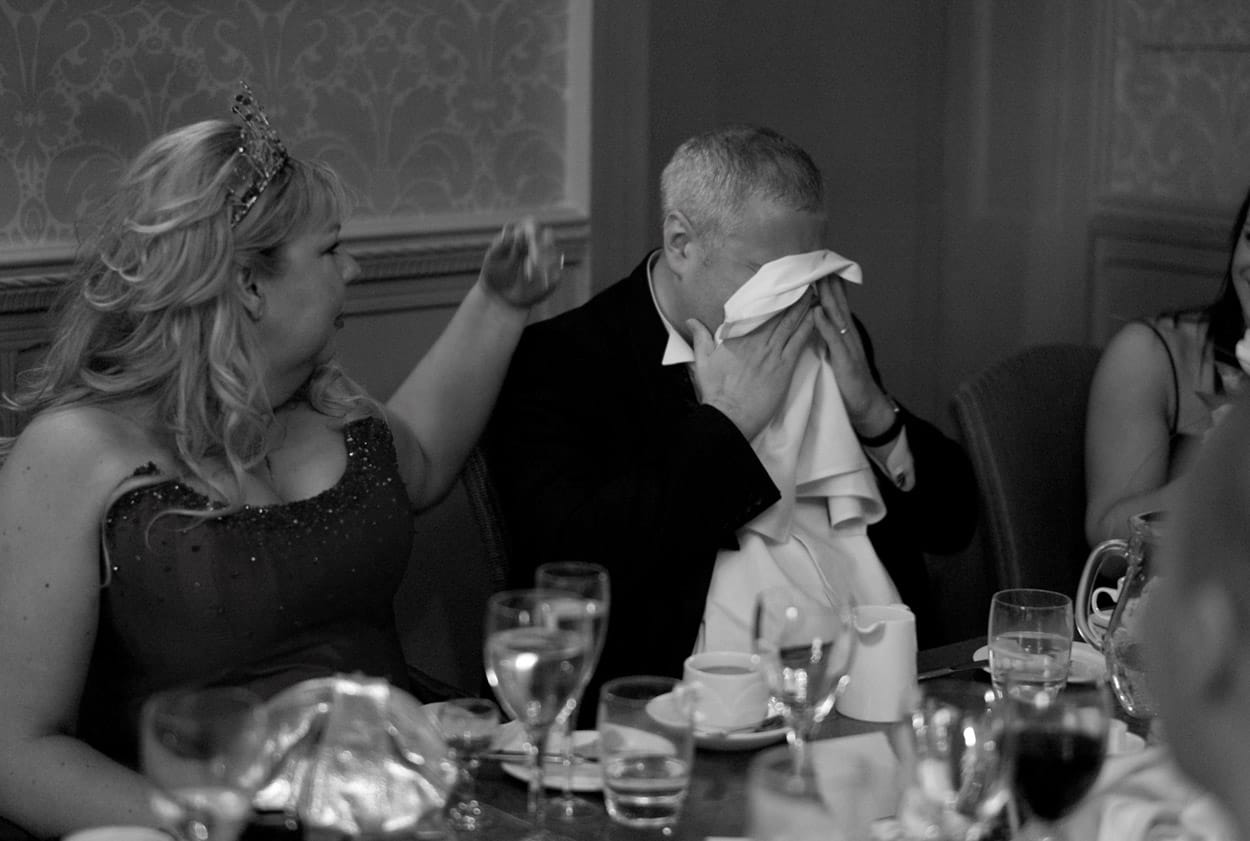 Emotional close-up of the groom during the sons’ speeches.