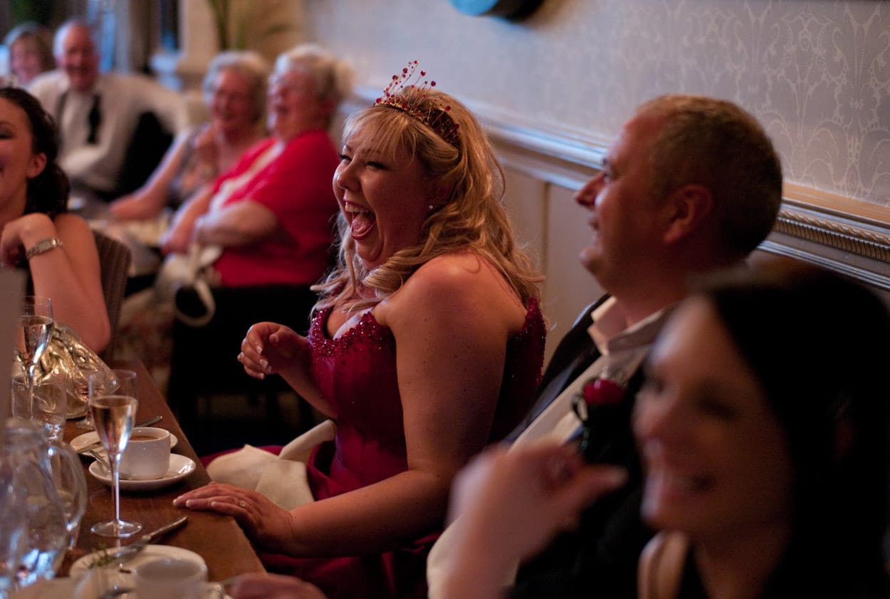 Nikki laughing with full joy during the speeches.