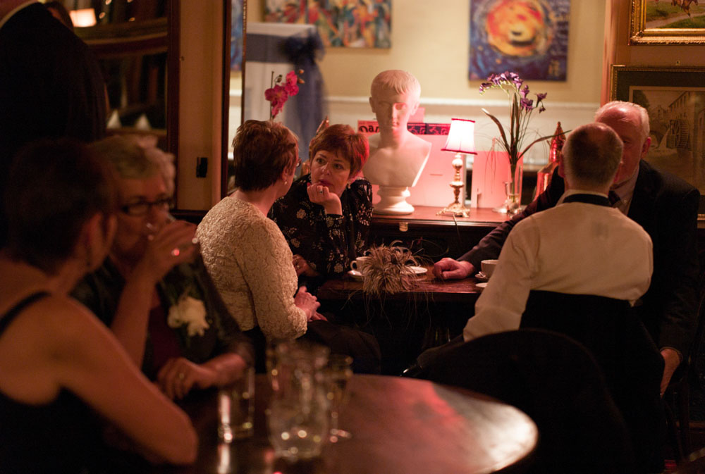 Guests move from the wedding breakfast into the warmth of the bar and table areas.