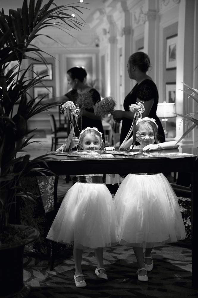 Two young bridesmaids smiling naturally, unposed and relaxed.
