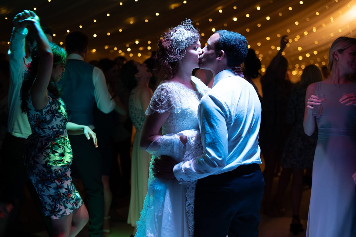 Tender moment between couple during their wedding, captured by Tim Christian Jones in Leeds.