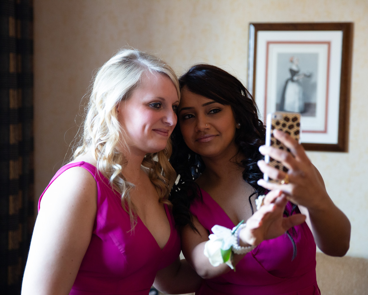 Groom Richard in black and white, relaxed and smiling during prep