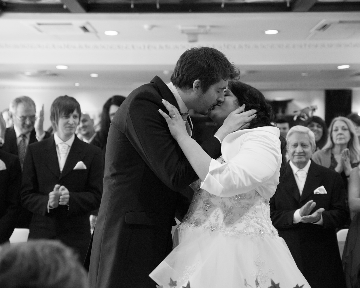 Couple portrait in garden at Crowne Plaza Leeds with sunshine and soft green light