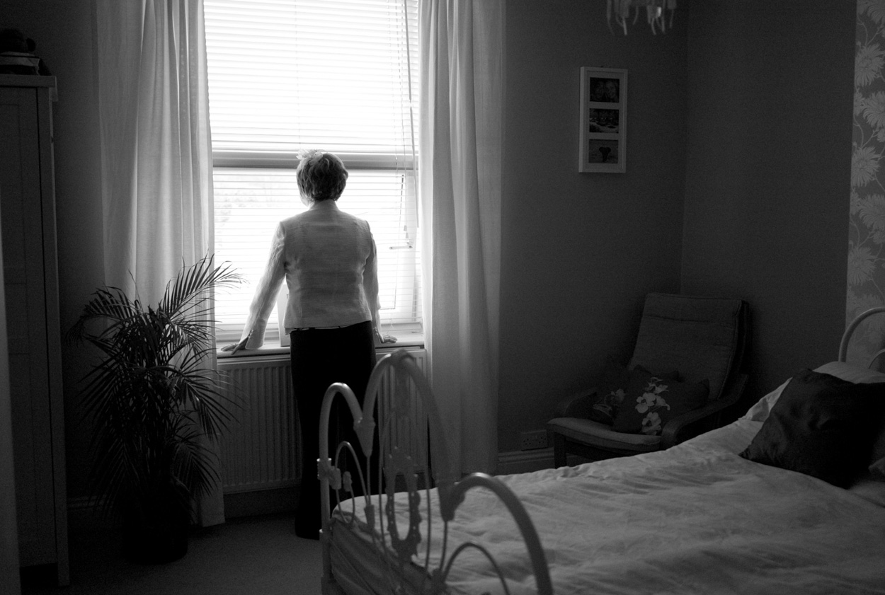 Dani’s mum gazes out the window in search of the wedding car