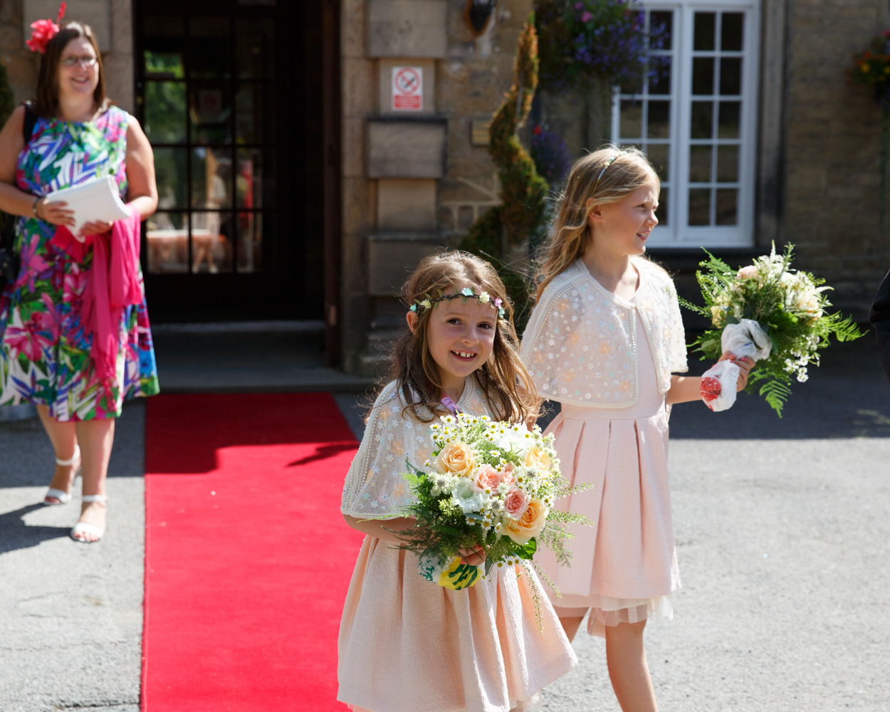 The couple's children - summer wedding bridesmaids in summer sun