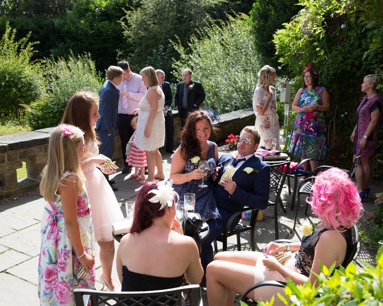 Guests enjoying summer sun at this Yorkshire wedding