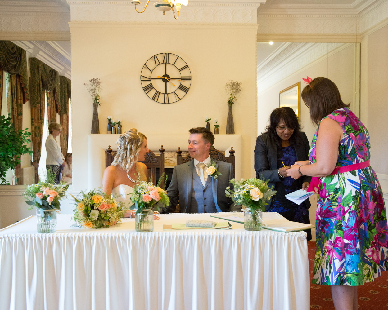 Signing the register at Hoyle Court WEDDING