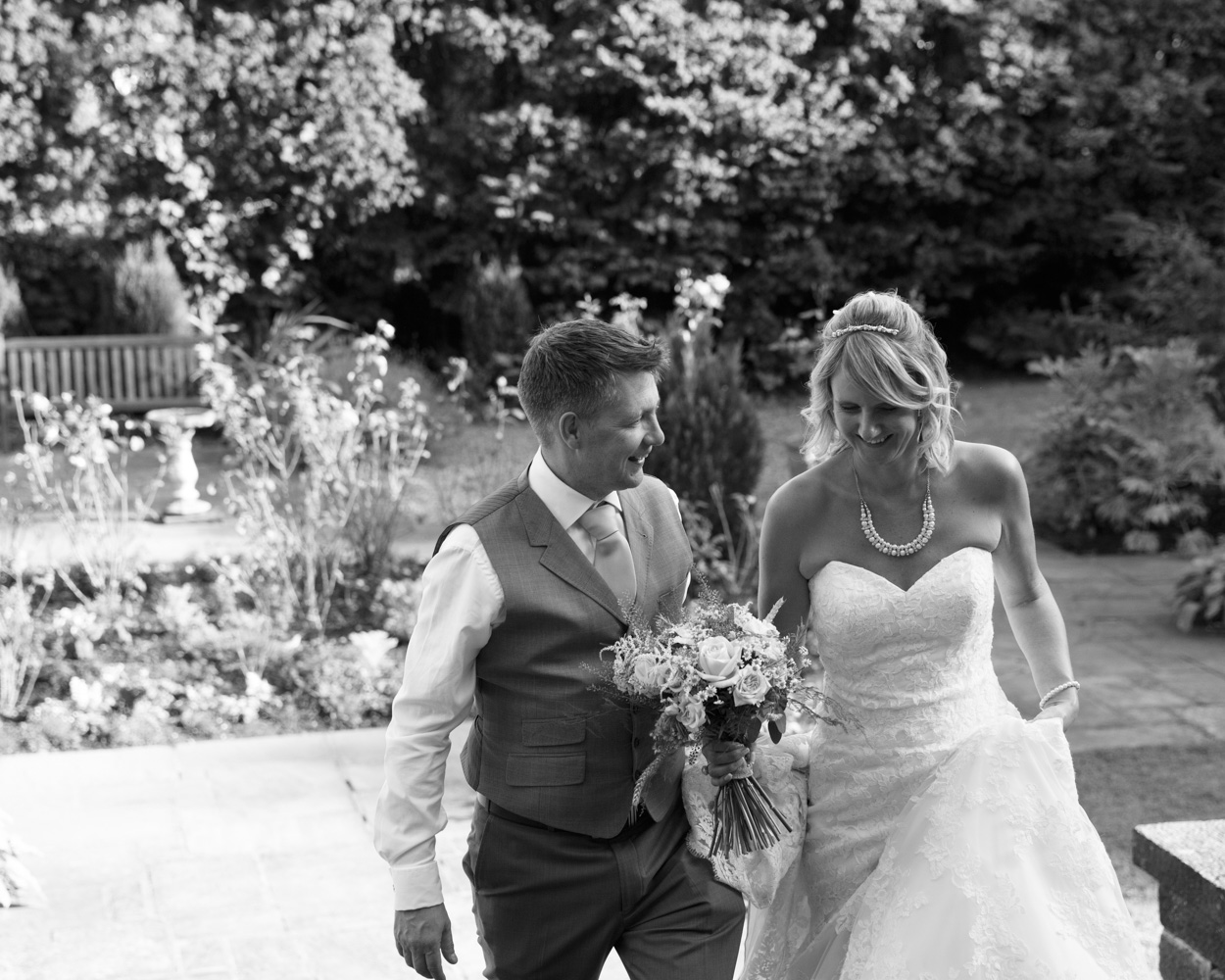 The couple ascend the stone steps