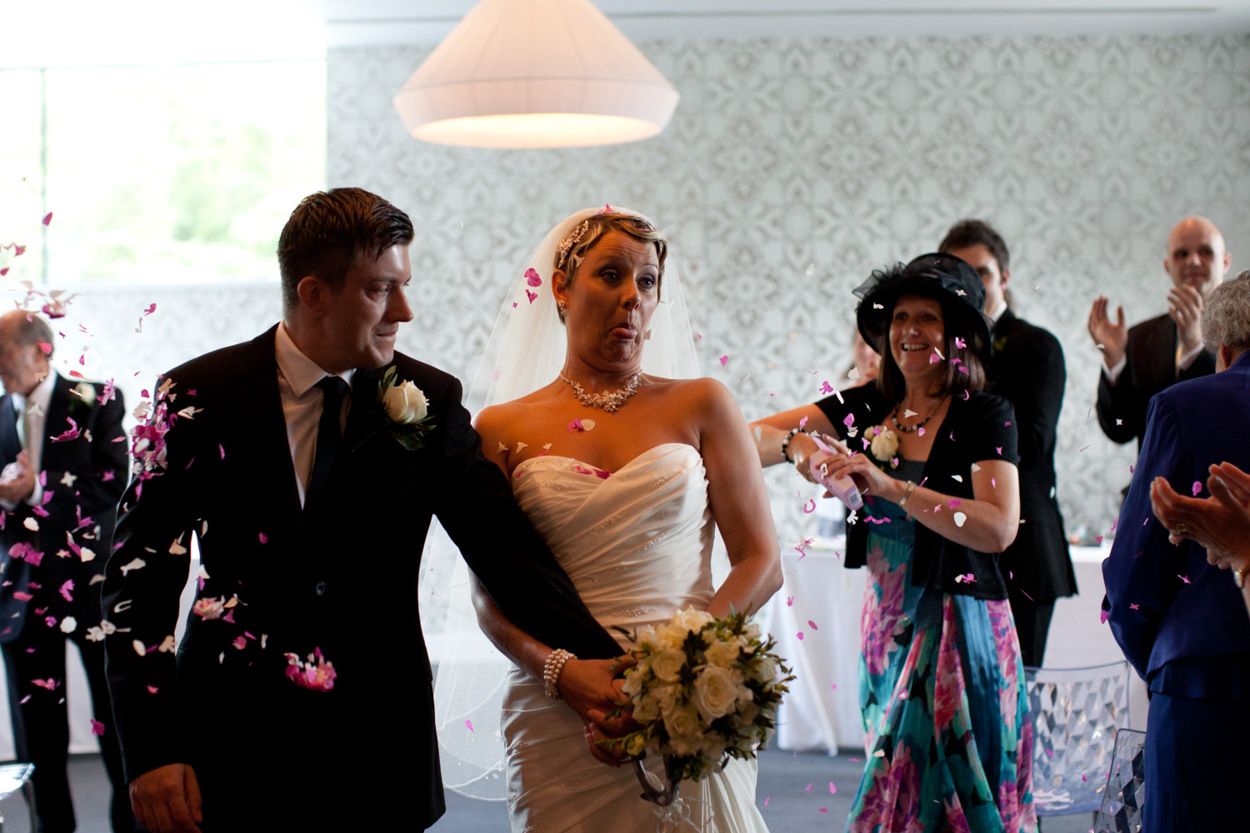 Sam receives a joyful kiss on the cheek from a friend after the ceremony.
