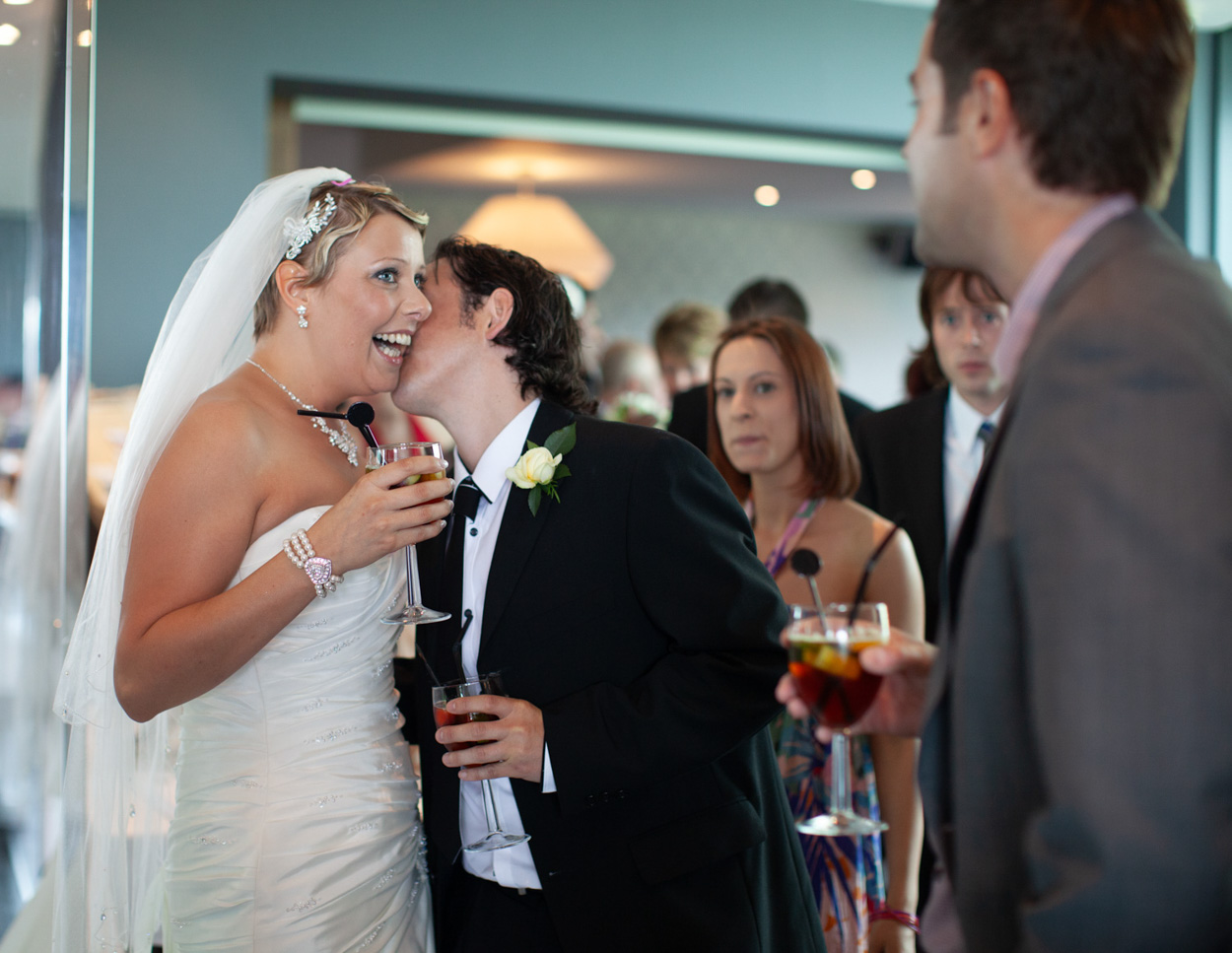 More guests gather around Sam as she exits, smiles all around.