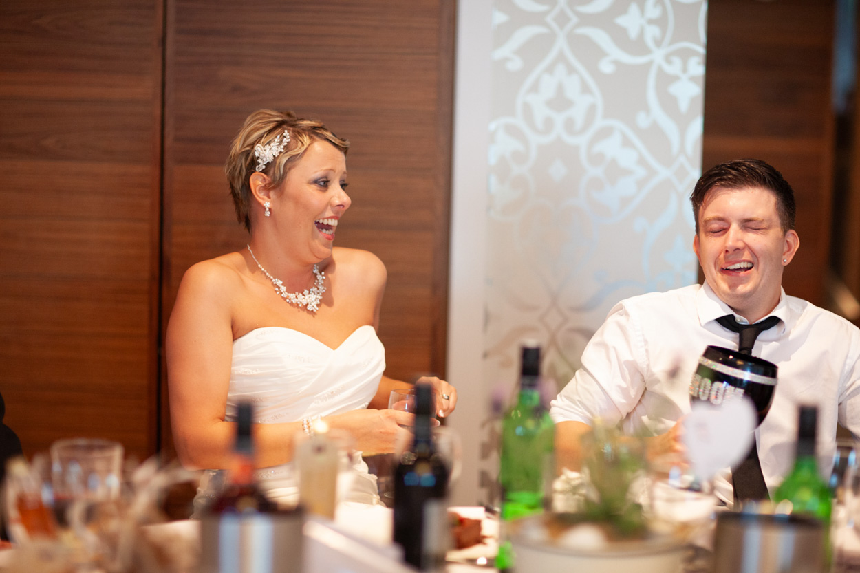 The best man continues his lively speech, clearly enjoying every moment.