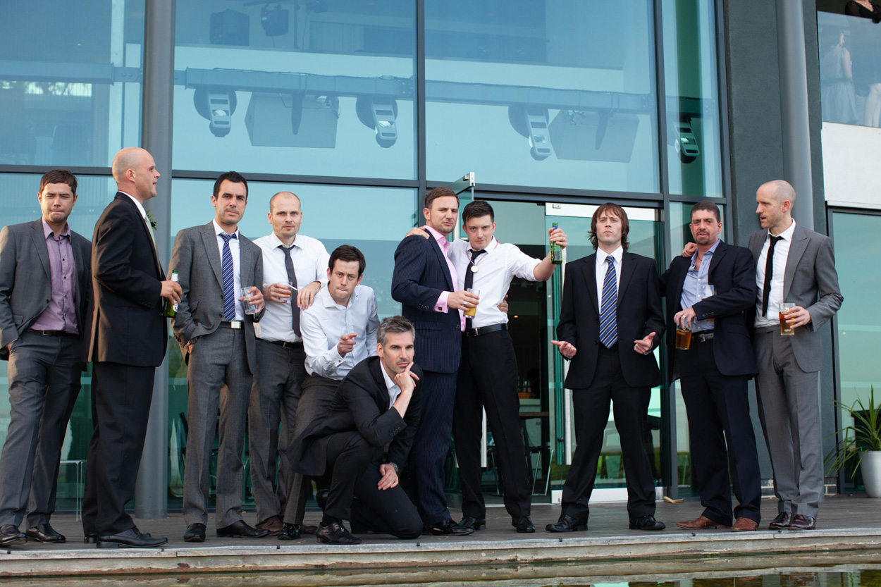 One guest playfully splashes water while others laugh, full of fun and personality.