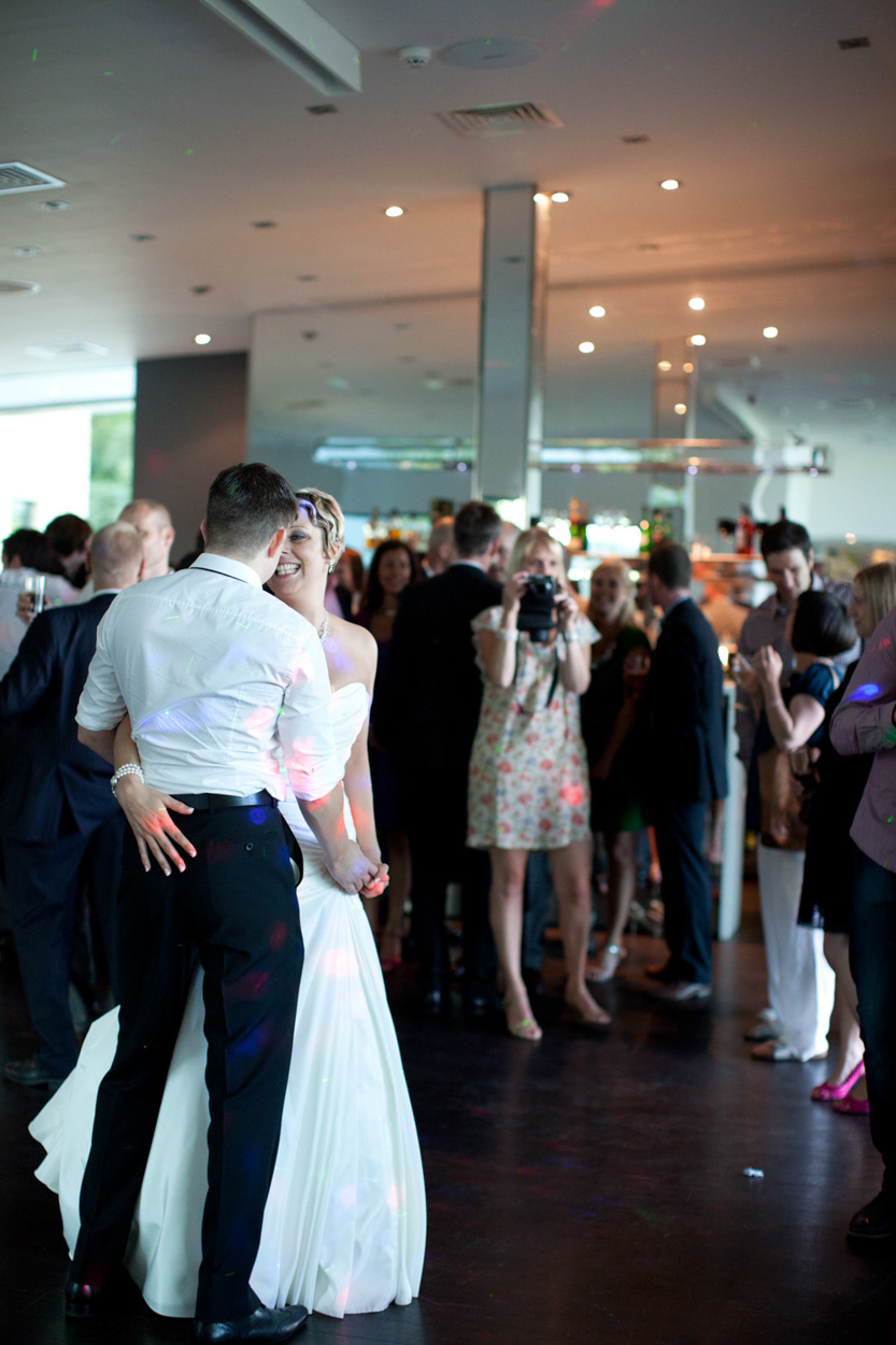 Close-up of the couple’s hands intertwined during the dance.