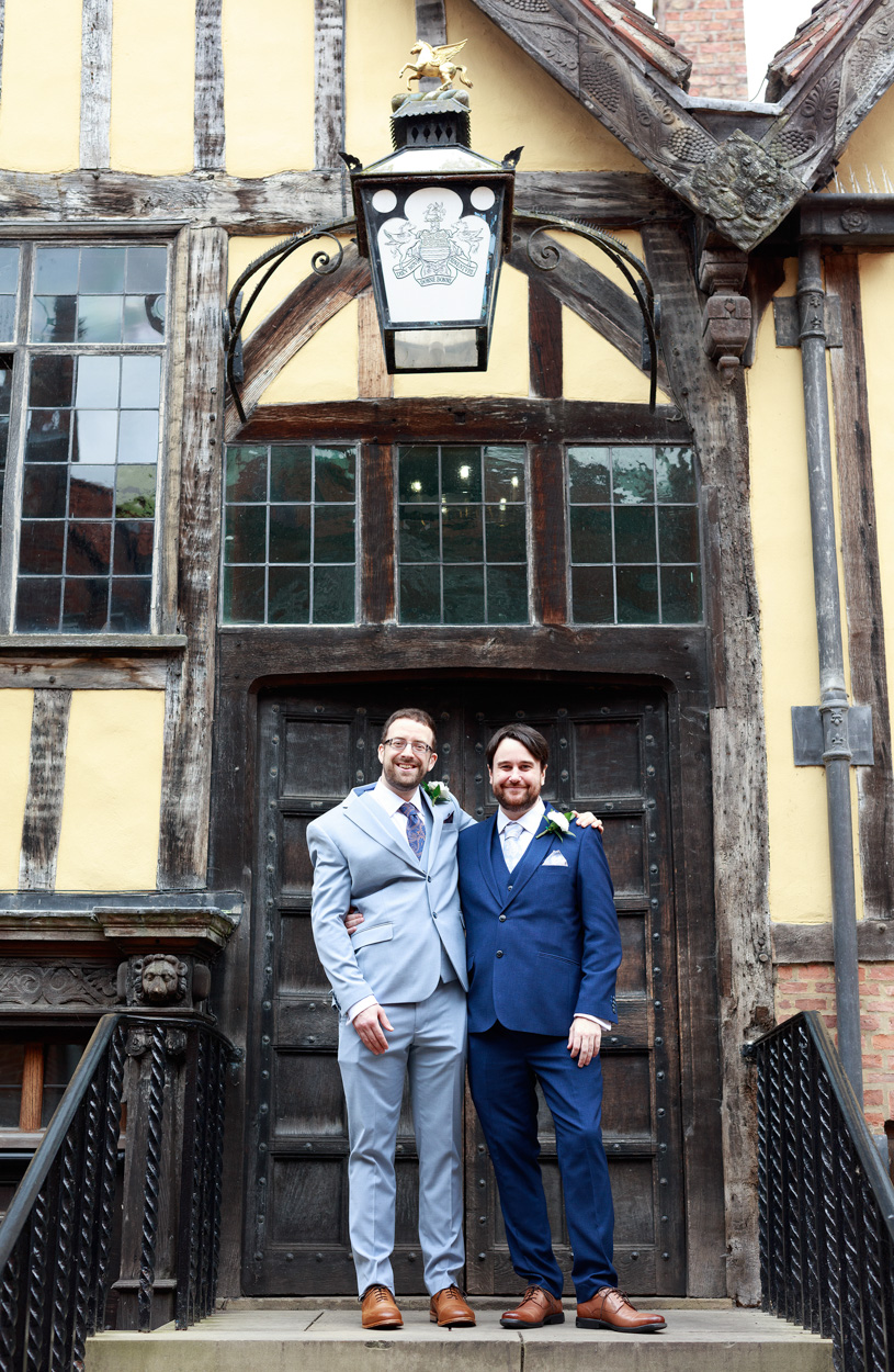 Grooms stood on the steps at Merchant Adventurers Hall in York