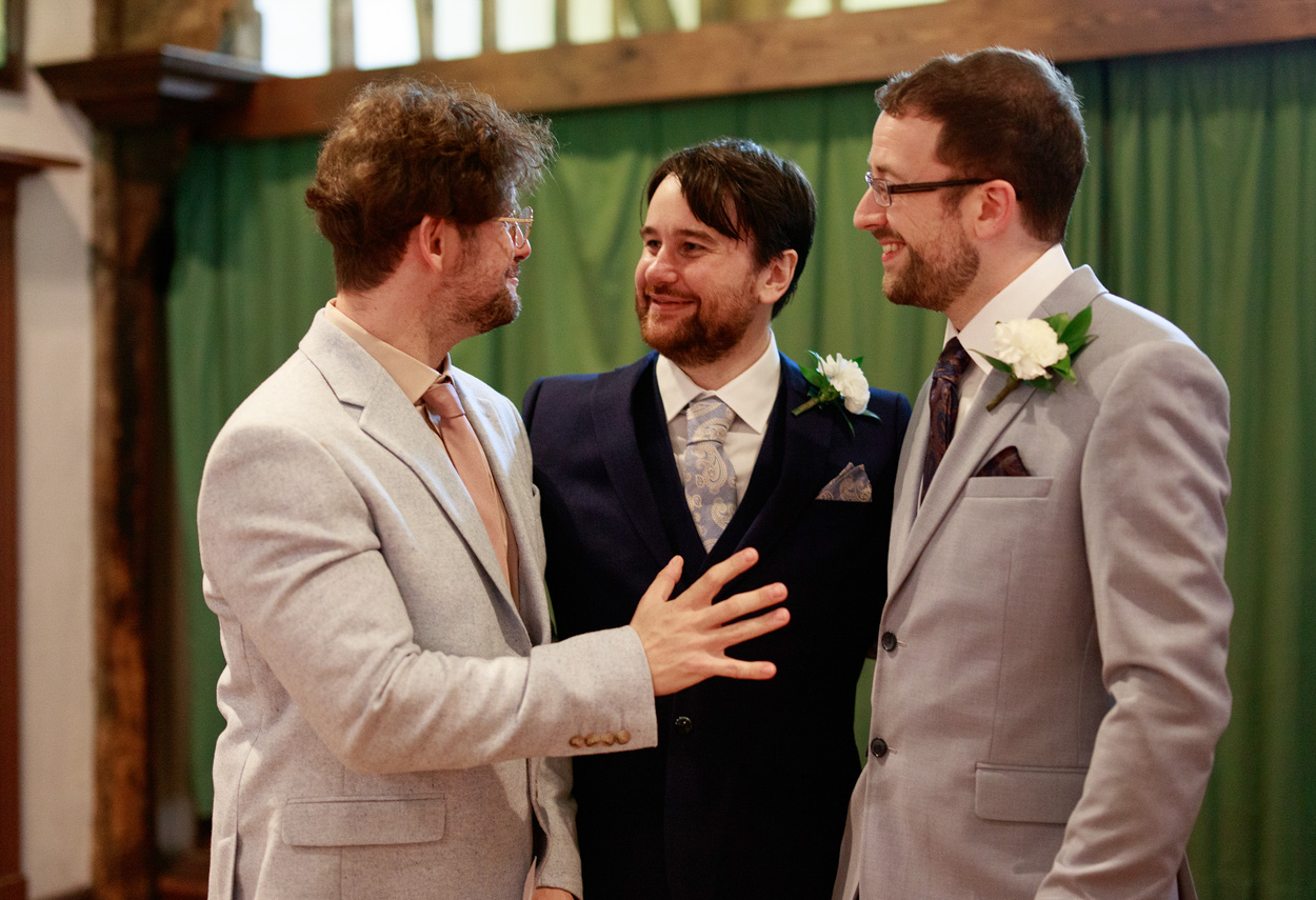 Grooms and best man after the wedding ceremony