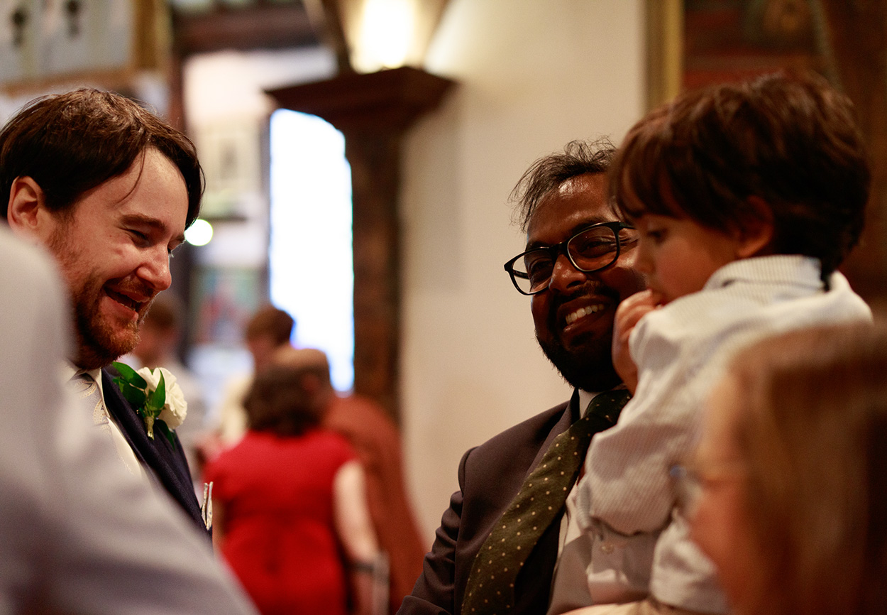 Grooms mixing with guests after the wedding ceremony