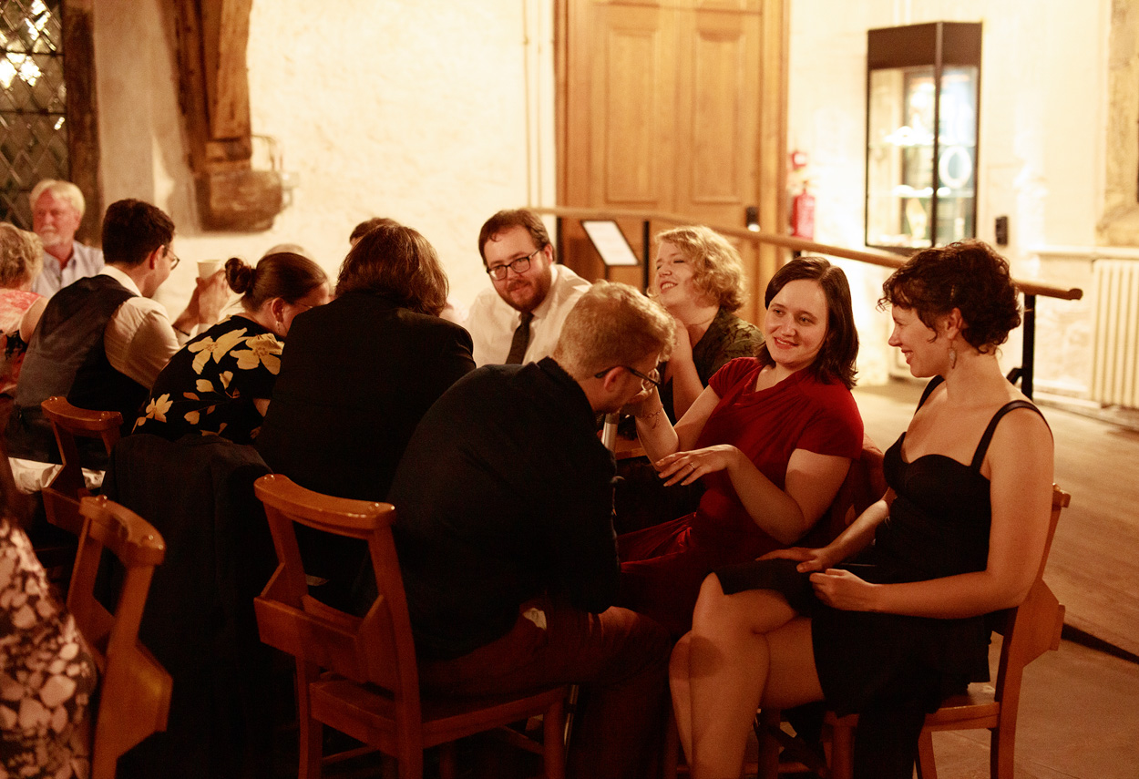 Guests sat relaxing and chattin as the end of the celebrations draw near at Merchant Adventurers Hall