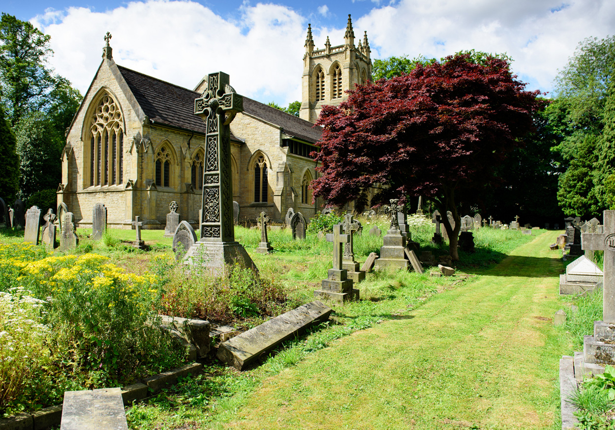 Quarter-angle view of St Paul’s Church surrounded by trees and beauty in Huddersfield.
