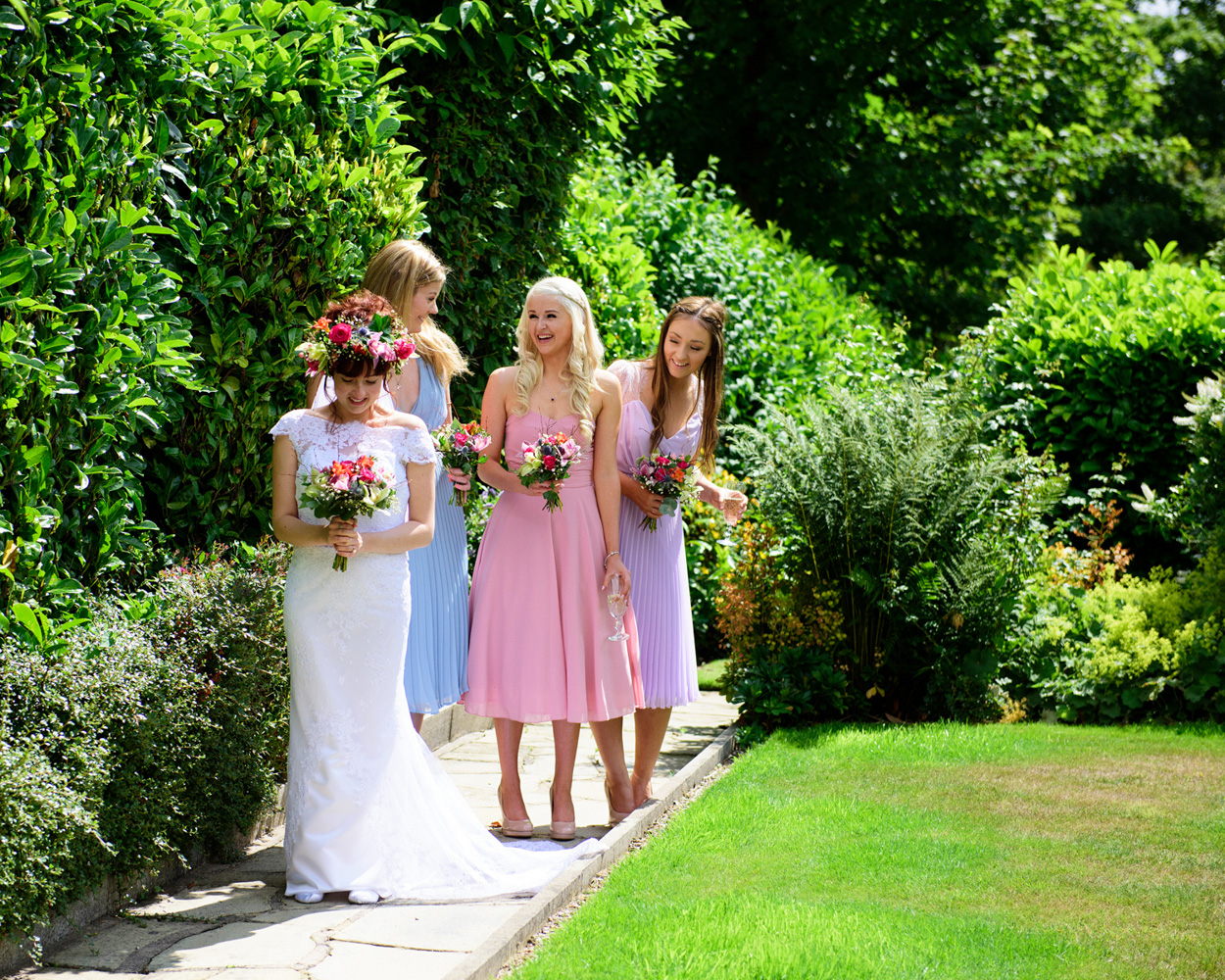 Bride and father in garden light before the ceremony — candid West Yorkshire wedding photography.