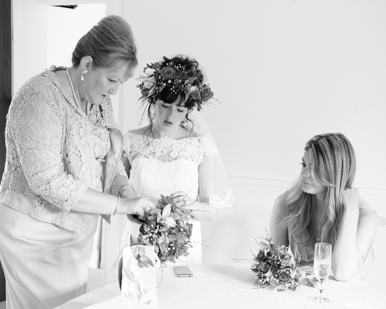 Father of the bride looks at Chloe — flowers in her hair, joy in her eyes.