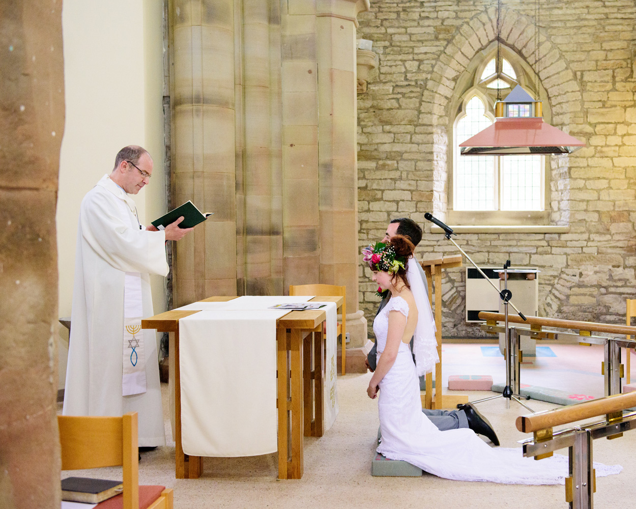 Wedding guests shower the couple with confetti outside St Paul’s Church in Huddersfield.