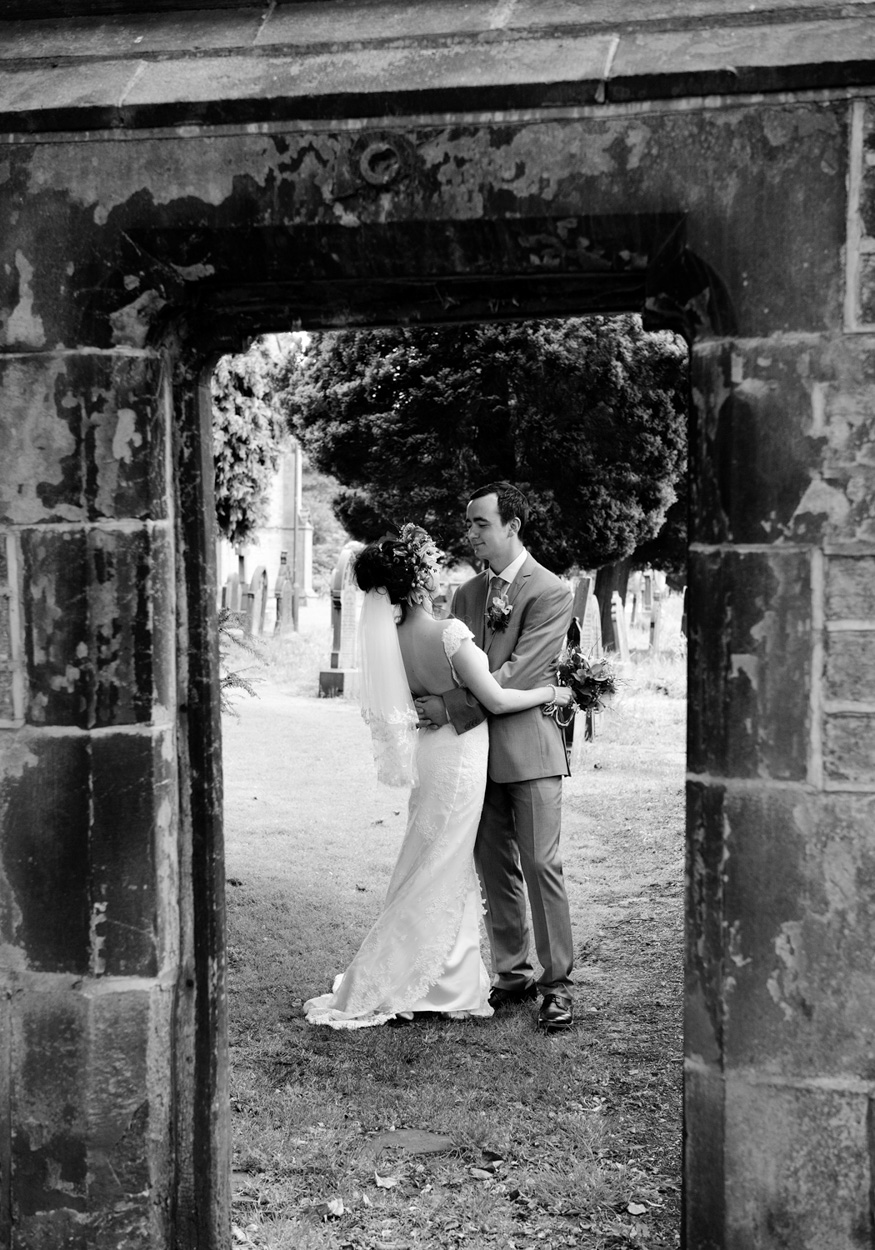 Inside the Papakata tent: a stacked ‘cheese’ wedding cake glowing pink under the lights.