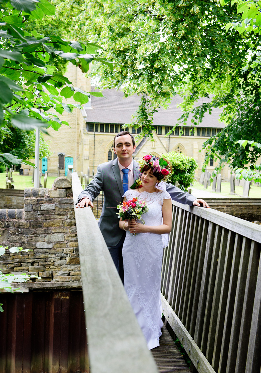 Best man number one entertains guests inside the tent, looking up mid-speech.