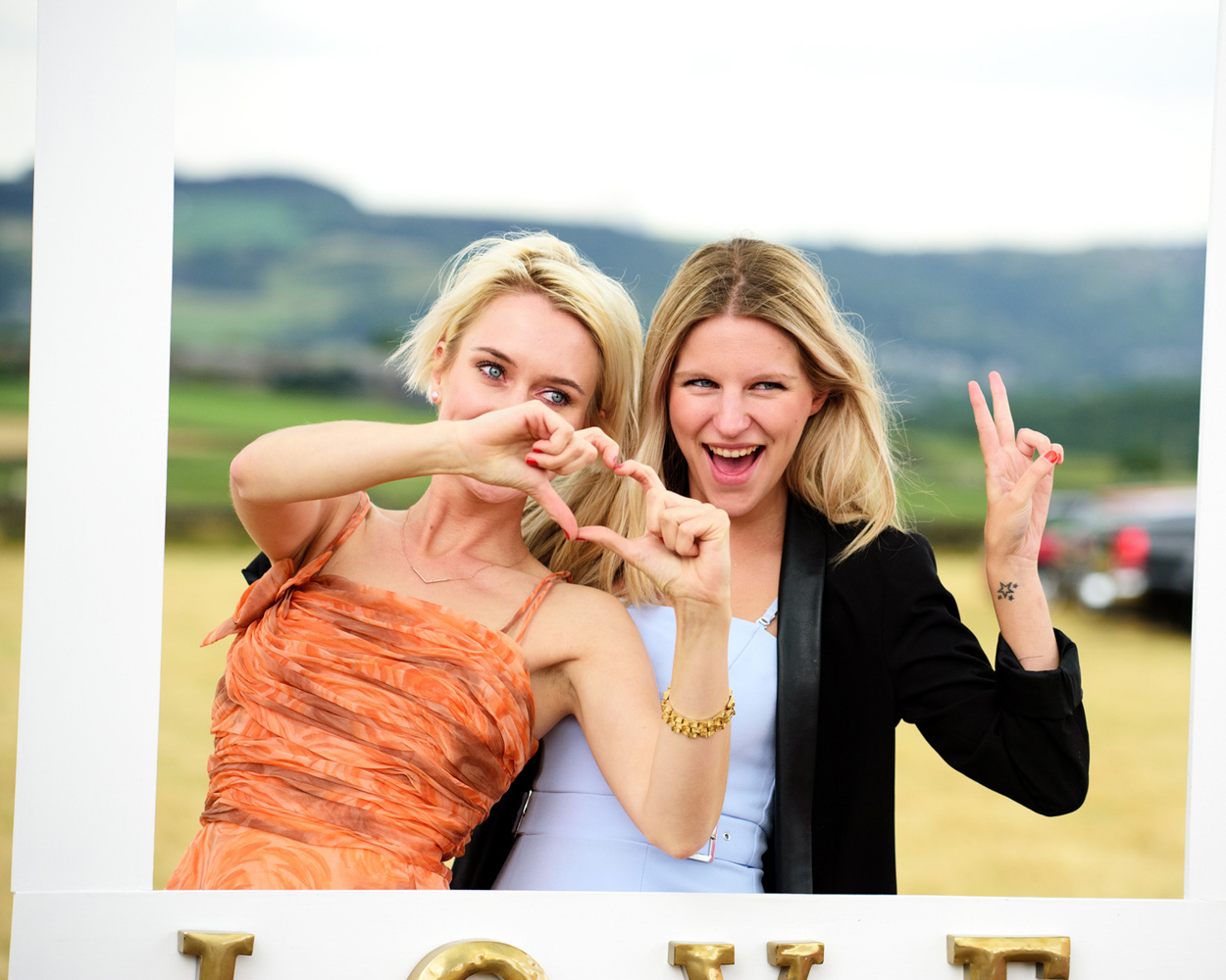 The couple laugh during the best man’s wedding speech.