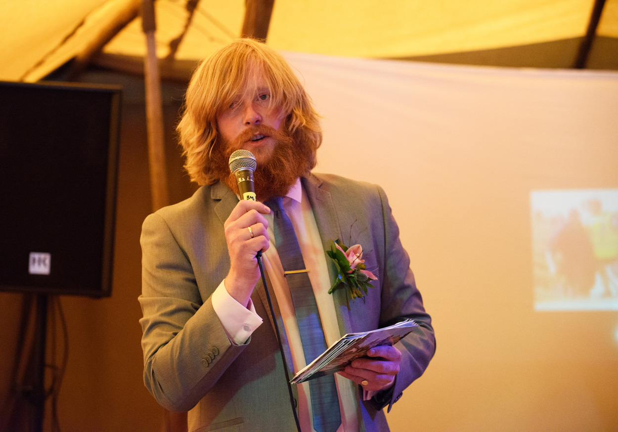 Chloe and John cut their savoury cheesecake together at the Papakata tent.