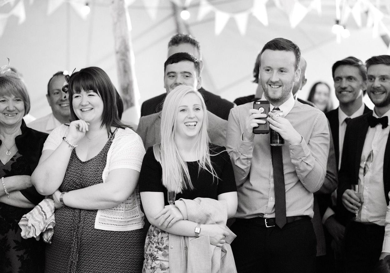 Bride and groom enjoy ceilidh dancing at their West Yorkshire wedding.