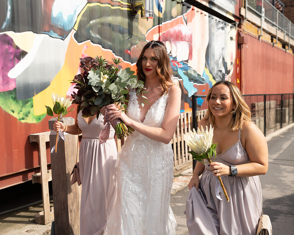 Bride and bridesmaids walking through York’s cobbled streets toward Merchant Adventurers’ Hall for the ceremony.