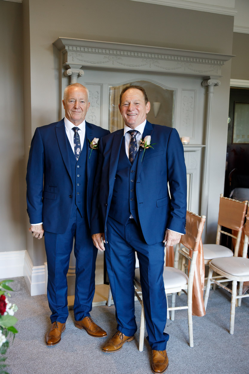 Groom and Best man in blue suits looking smart and happy