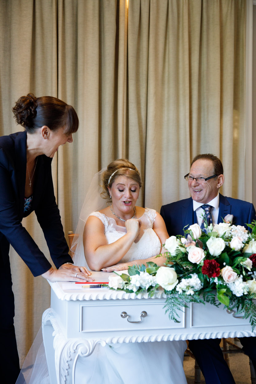 Signing the wedding register at the Woodlands Hotel wedding ceremony